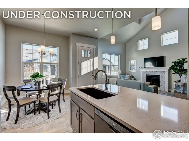 a kitchen with a table chairs and a dining table