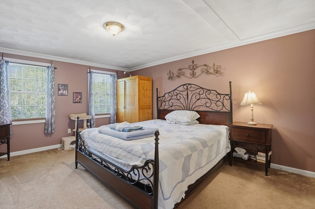 160 Gray Road Templeton, MA 01468 - Photo 24 of 42 a bedroom with a bed and a table in it