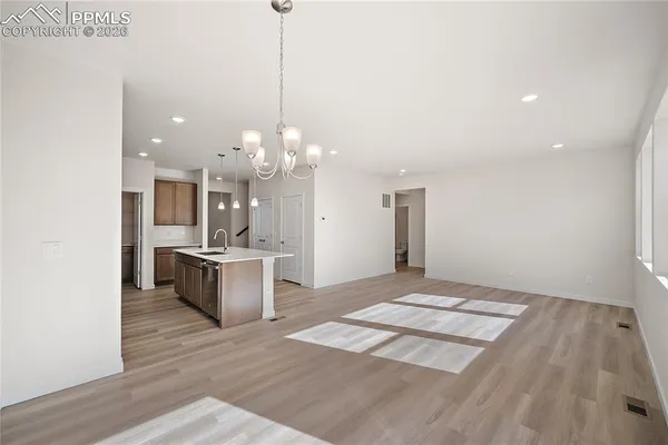 a view of entryway with wooden floor and stairs