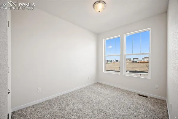a kitchen with stainless steel appliances granite countertop a sink a stove and a wooden floors