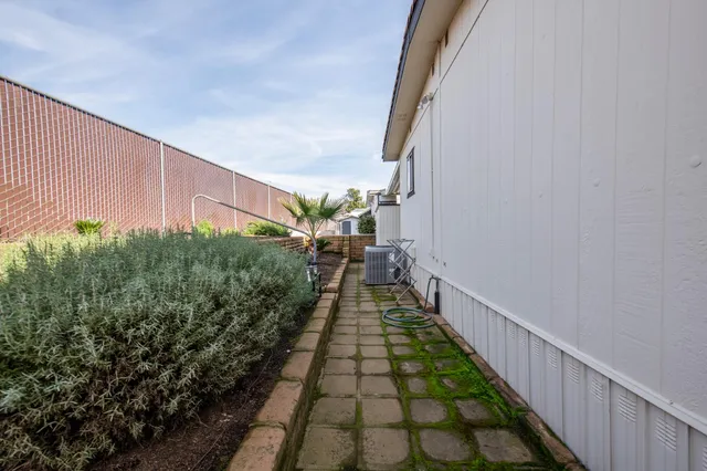 a view of a pathway of a house with wooden floor
