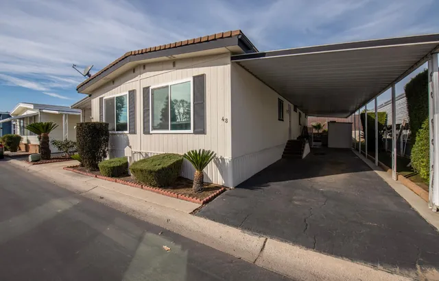 a front view of a house with garage