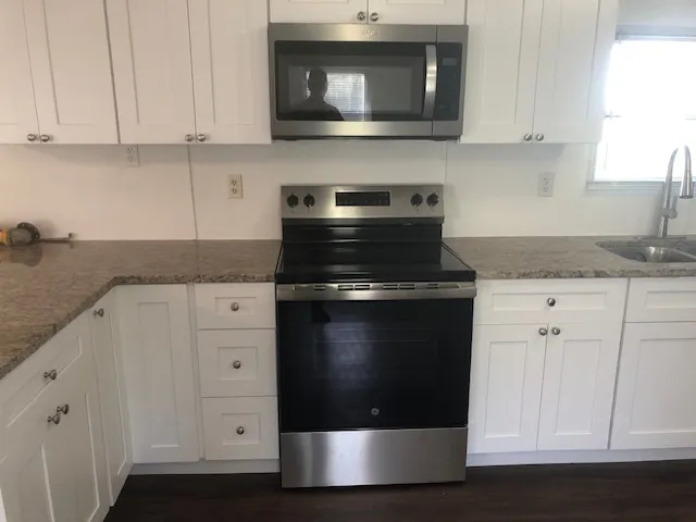 a kitchen with a sink and cabinets