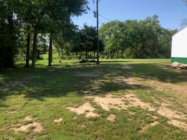 a view of an outdoor space and basketball court