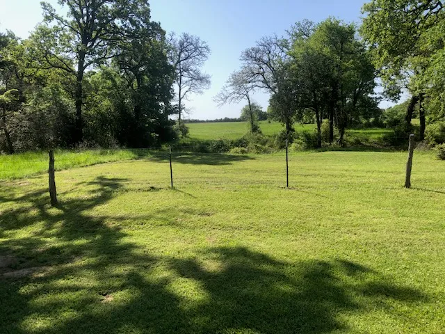 a view of a lake with houses in the back