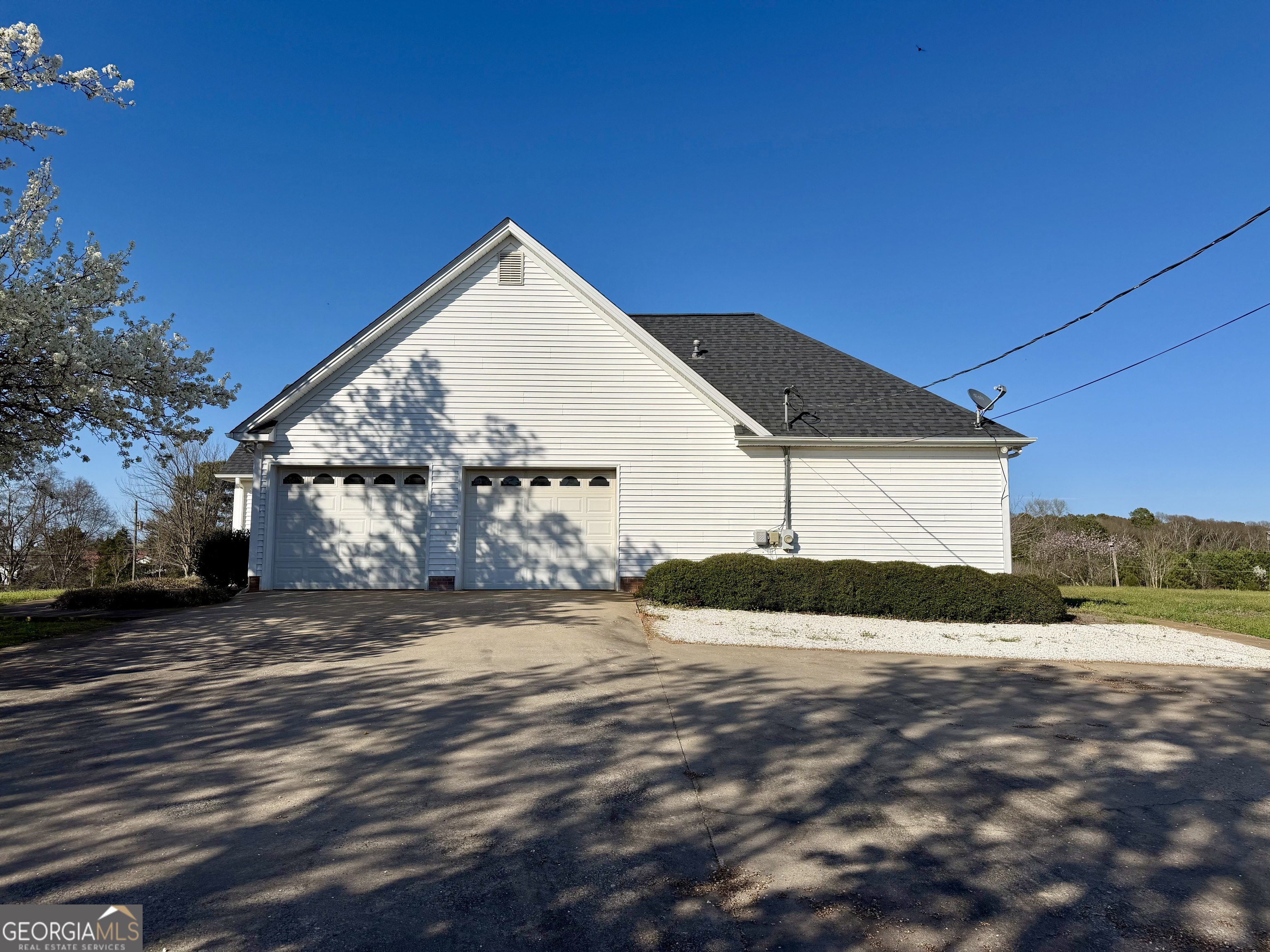 494 Broad Street Bowman, GA 30624 - Photo 6 of 65 a view of a house with a yard