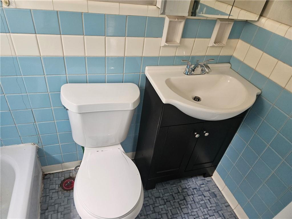 1905 Hanover Street, Unit 7 Pittsburgh, PA 15218 - Photo 17 of 22 a bathroom with a toilet and a sink