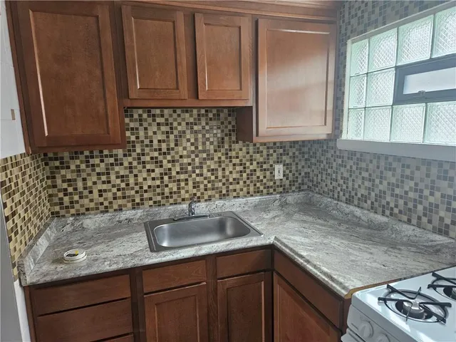 a white refrigerator freezer and a dishwasher sitting in a kitchen