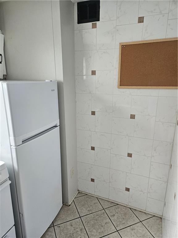 1905 Hanover Street, Unit 7 Pittsburgh, PA 15218 - Photo 9 of 22 a white refrigerator freezer and a dishwasher sitting in a kitchen