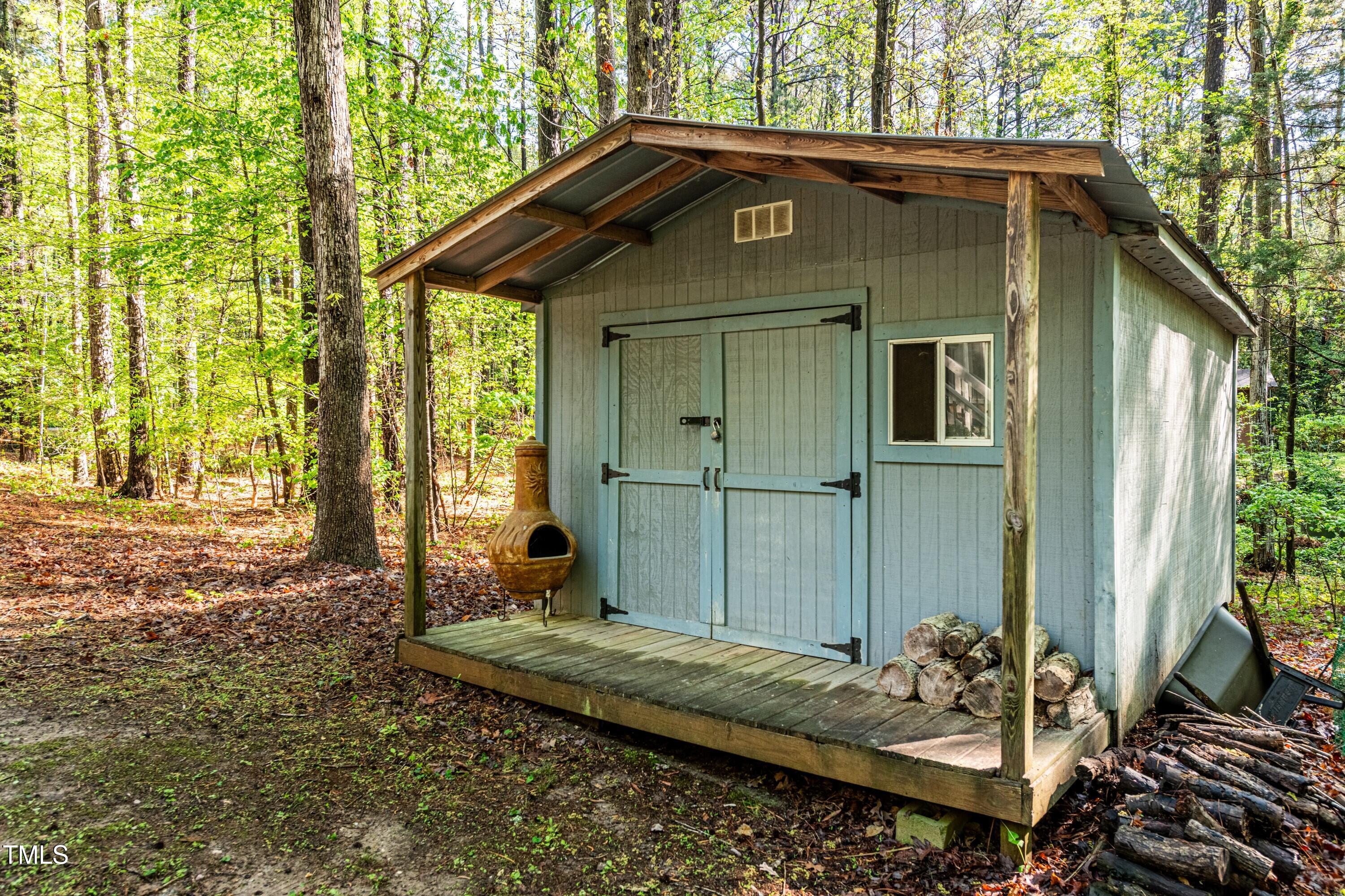 Undisclosed Address Raleigh, NC 27613 - Photo 2 of 3 a front view of a house with a yard