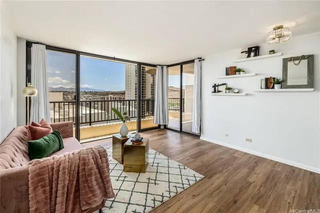 a living room with furniture and a large window