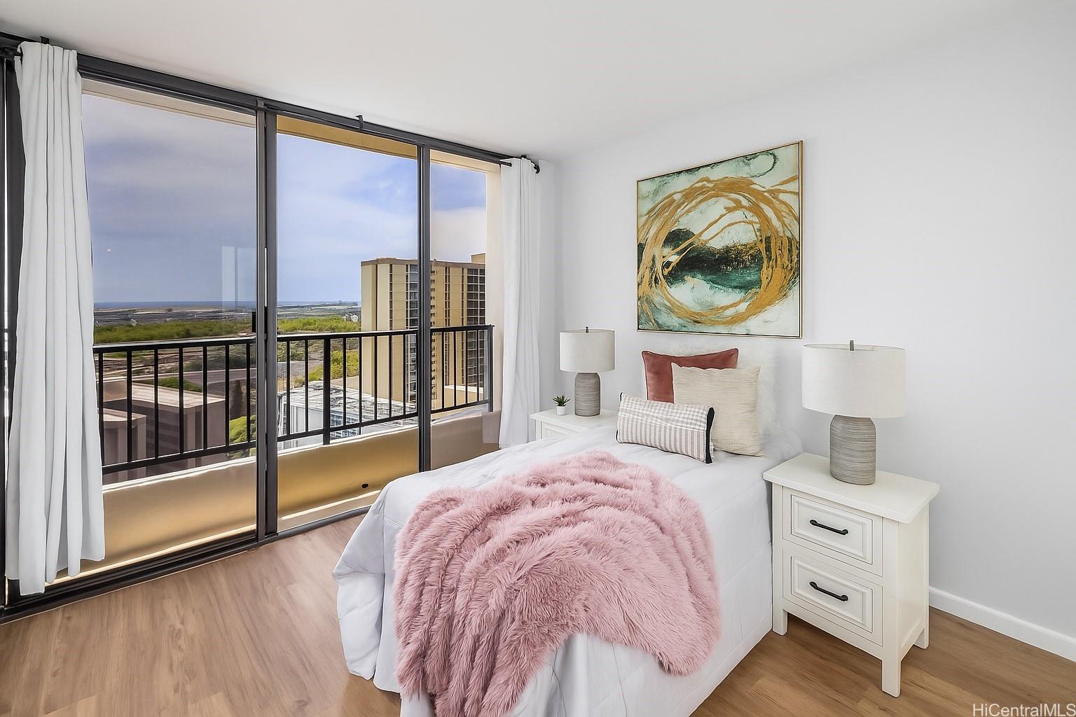 3130 Ala Ilima Street, Unit 21C Honolulu, HI 96818 - Photo 14 of 21 a bedroom with a bed and a painting on the wall