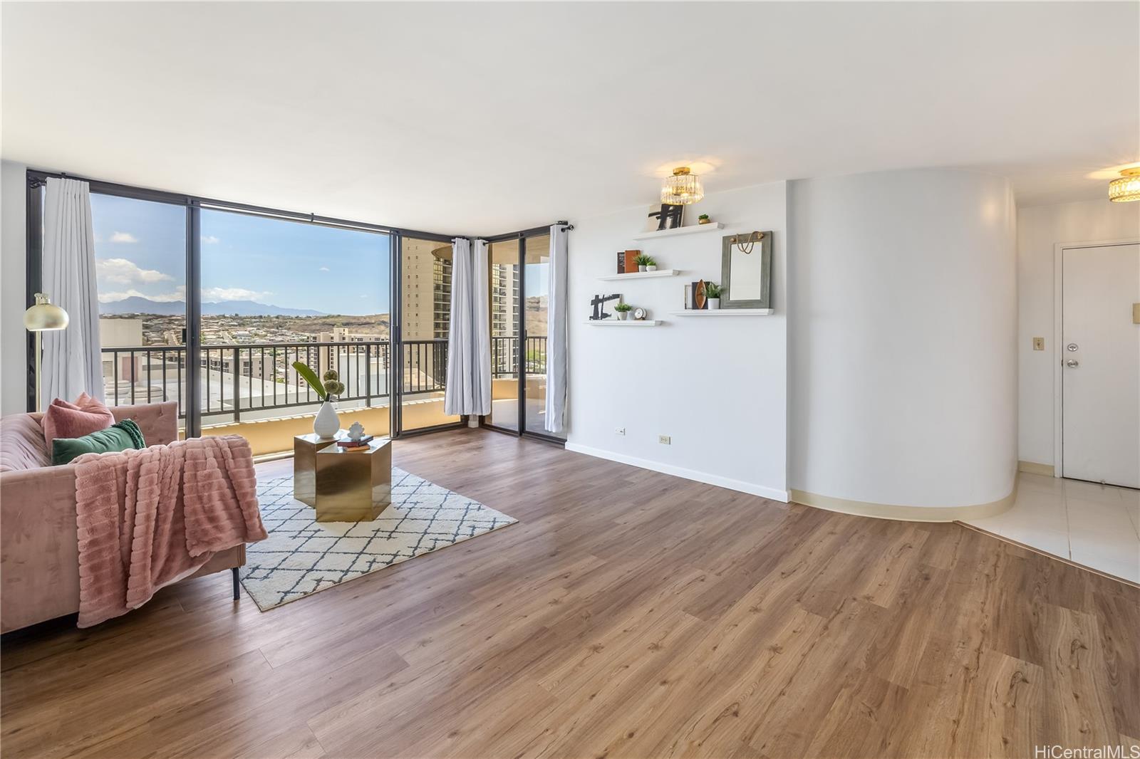 3130 Ala Ilima Street, Unit 21C Honolulu, HI 96818 - Photo 2 of 21 a living room with furniture and a large window