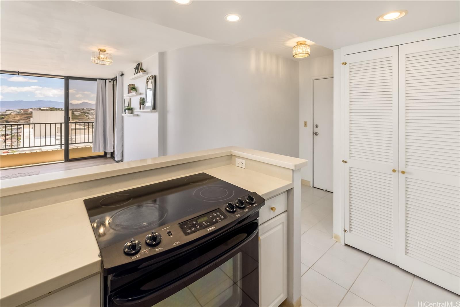 3130 Ala Ilima Street, Unit 21C Honolulu, HI 96818 - Photo 9 of 21 a kitchen with a stove and a refrigerator