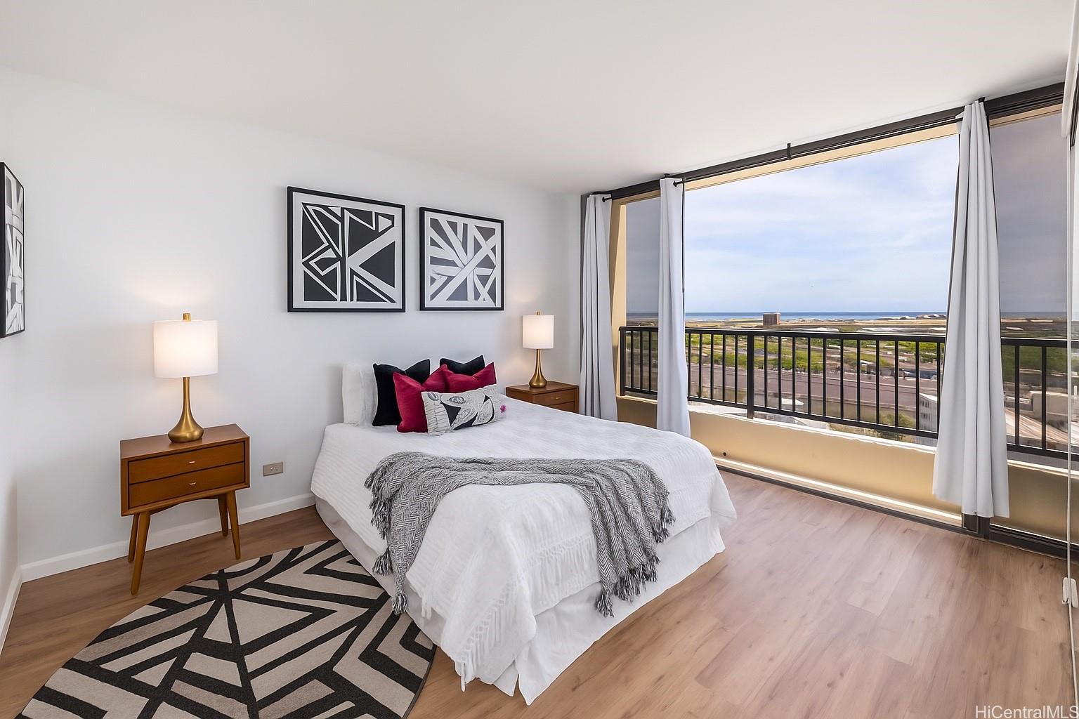 3130 Ala Ilima Street, Unit 21C Honolulu, HI 96818 - Photo 10 of 21 a bedroom with a bed and a large window