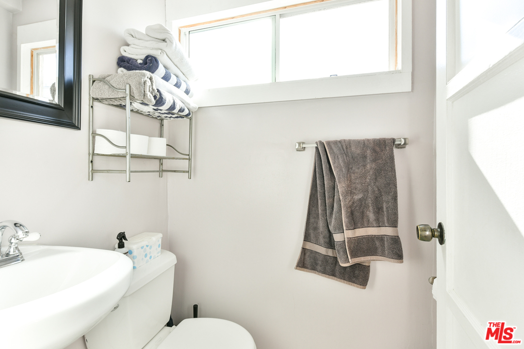 53 Dudley Avenue Venice, CA 90291 - Photo 12 of 28 a bathroom with a sink toilet and mirror
