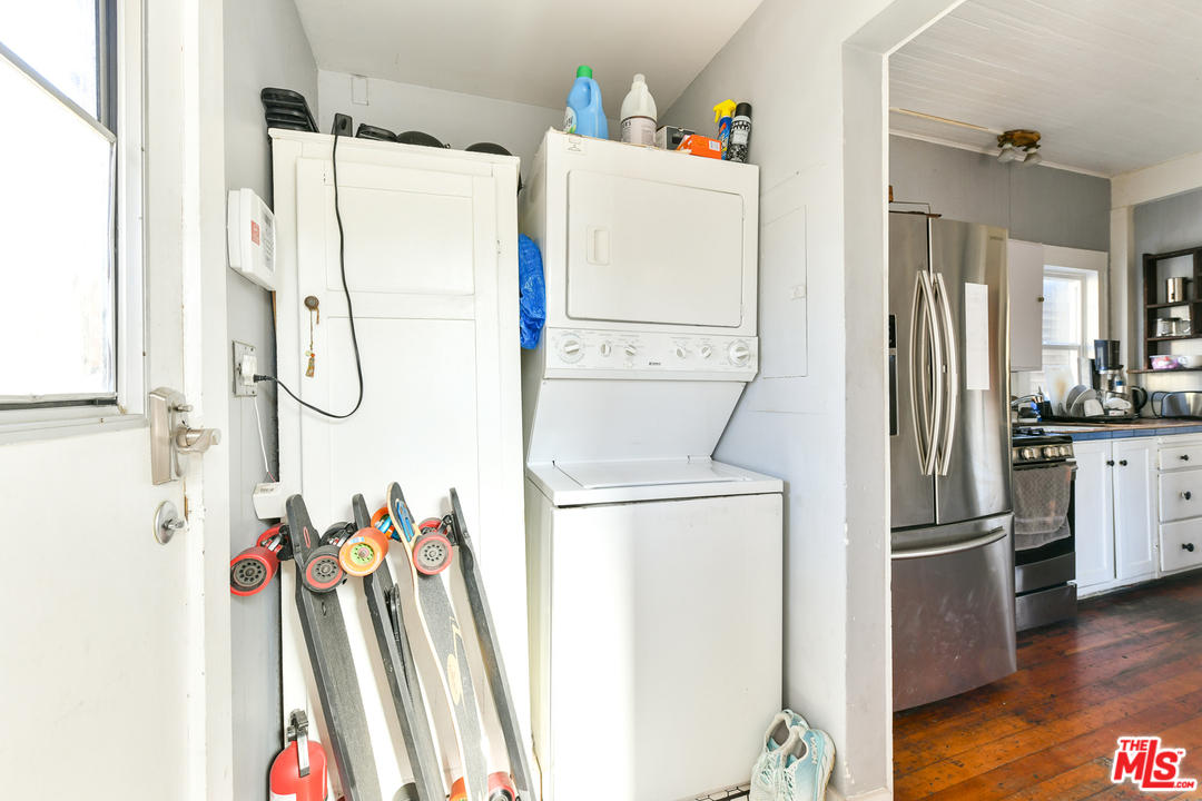 53 Dudley Avenue Venice, CA 90291 - Photo 13 of 28 a storage room with a refrigerator and wooden floor