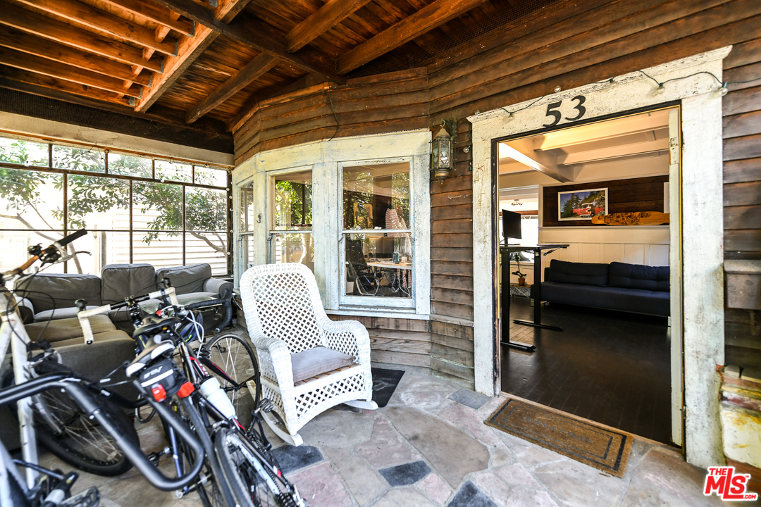 53 Dudley Avenue Venice, CA 90291 - Photo 3 of 28 a living room with furniture and a floor to ceiling window