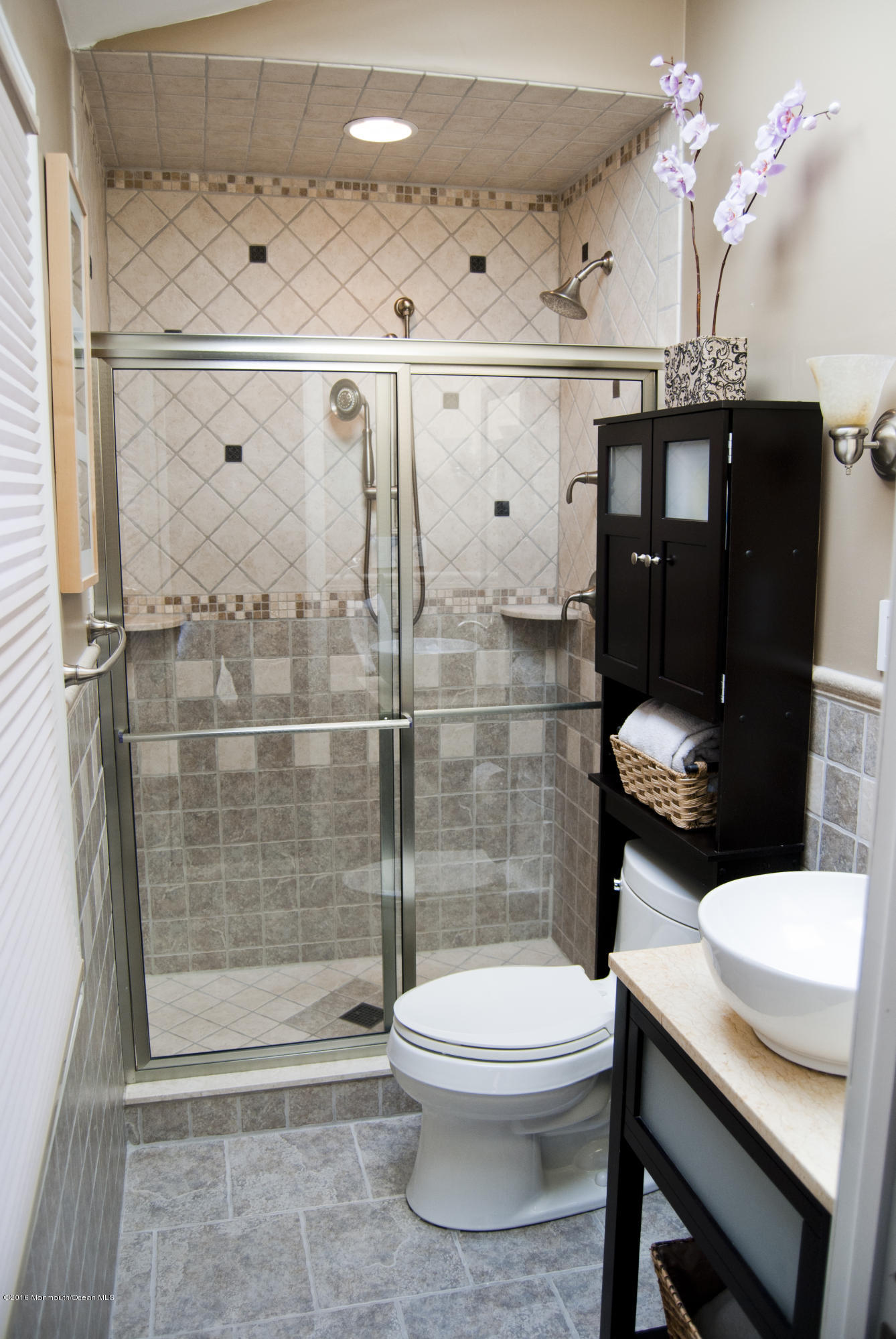 439 Line Road Aberdeen, NJ 07747 - Photo 11 of 22 a bathroom with a sink a toilet and shower