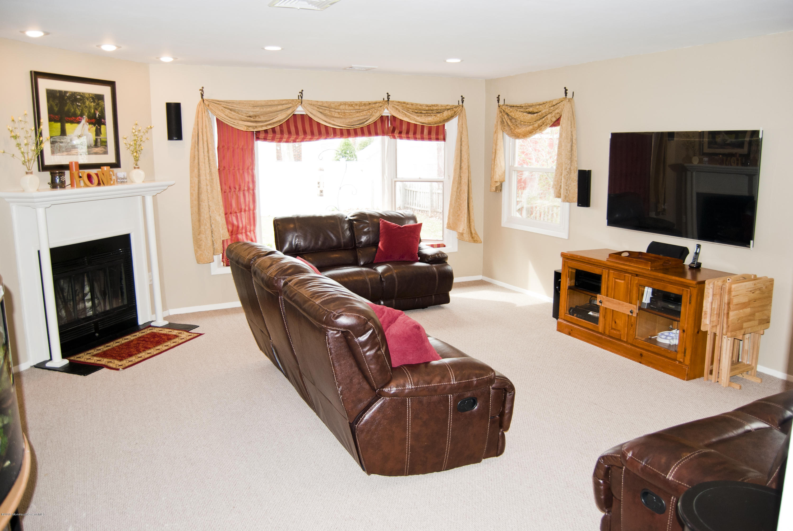 439 Line Road Aberdeen, NJ 07747 - Photo 5 of 22 a living room with furniture fireplace and flat screen tv