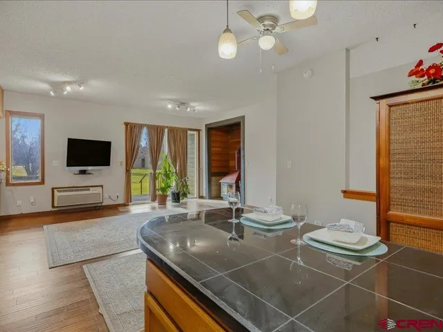 a room with two sinks and a flat screen tv