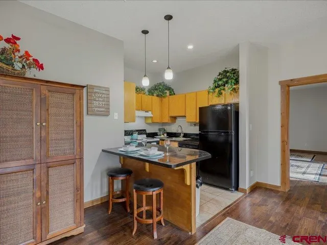 a kitchen with a table and chairs