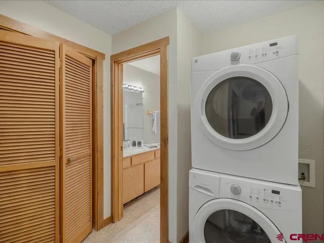 a view of a hallway with washer and dryer