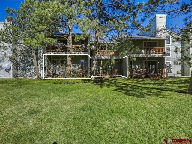 a view of a chairs and table in the garden