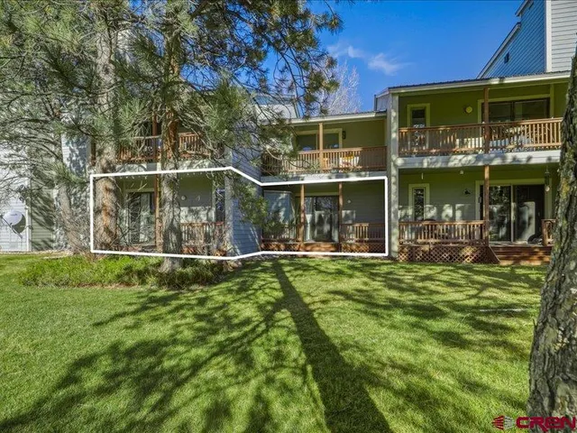 a view of a chair and table of the house
