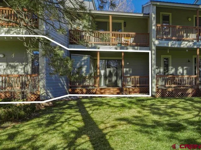 a view of house with yard