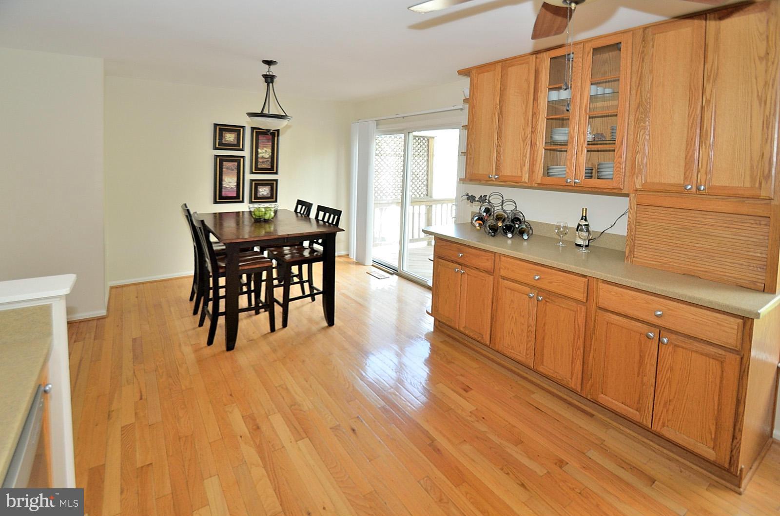 19933 Ridgecrest Square Ashburn, VA 20147 - Photo 6 of 19 a view of a kitchen counter space and wooden floor