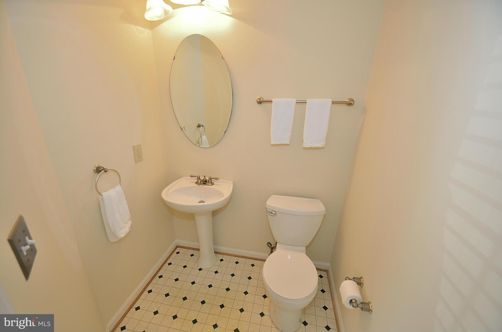 19933 Ridgecrest Square Ashburn, VA 20147 - Photo 10 of 19 a bathroom with a sink a toilet and mirror