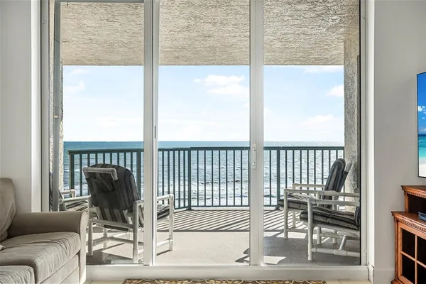 a view of a balcony with wooden floor