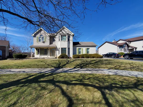 a view of a house with a yard