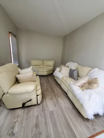 a bedroom with a bed and a couch