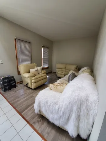a bedroom with two beds and a couch