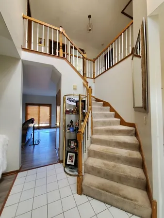 a view of entryway and hall with dining room