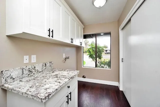 a view of a kitchen with a sink and a stove top oven