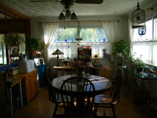 a view of a dining room with furniture window and outside view