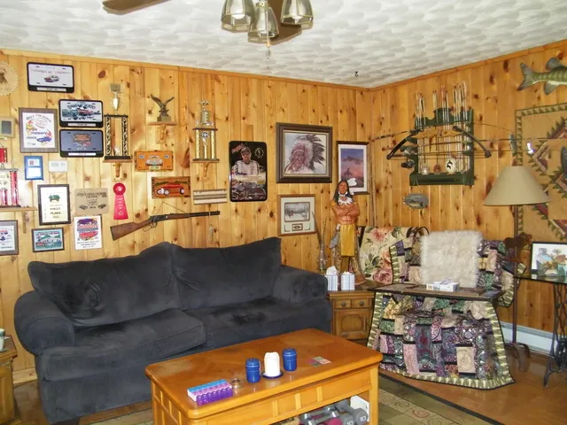 a living room with couch and a dining table