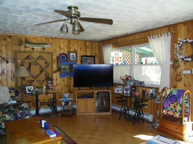 a living room with lots of furniture and a flat screen tv