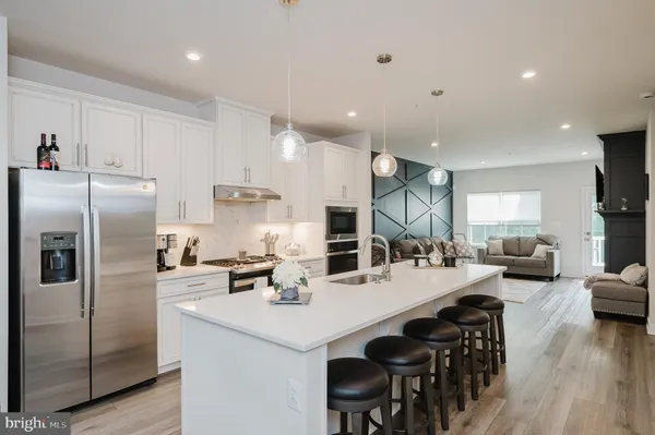 a kitchen with counter space cabinets and stainless steel appliances