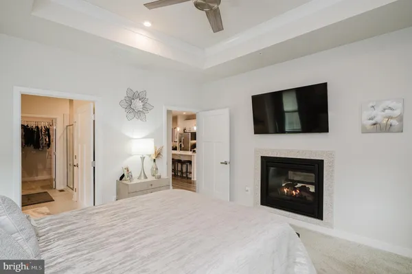 a bedroom with a bed and a fireplace