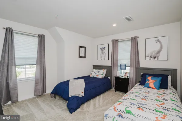 a bedroom with double bed and a window