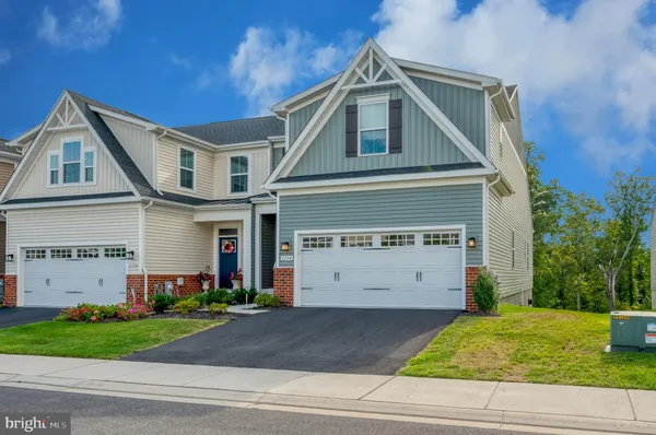 a view of a big house with a yard