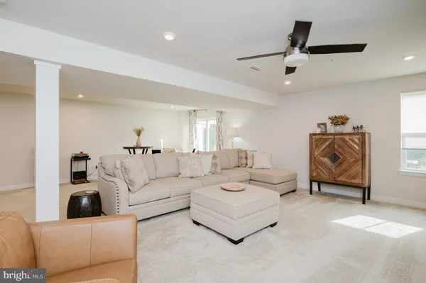 a view of a livingroom with furniture and stairs