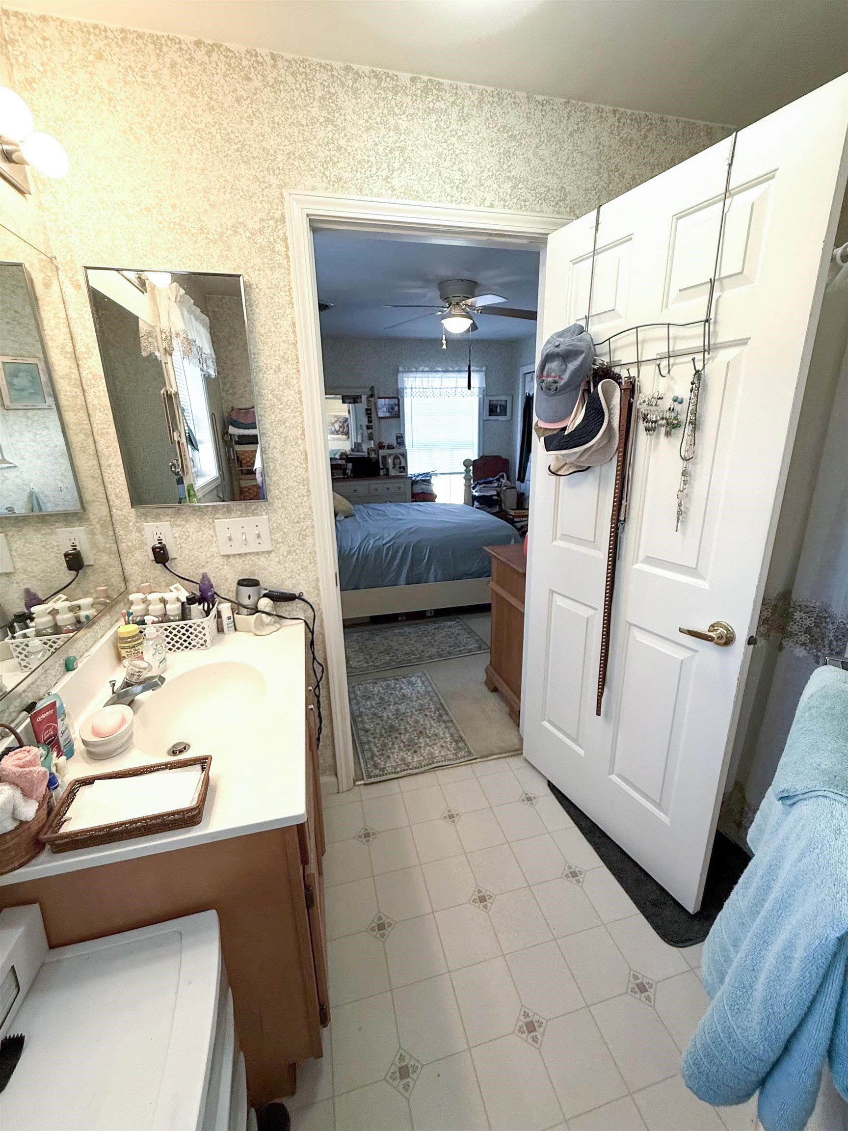 4 Rutledge Avenue Del Haven, NJ 08251 - Photo 16 of 21 a bathroom with a sink a mirror and shower