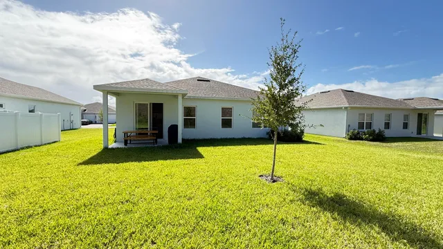 a view of a house with swimming pool and porch