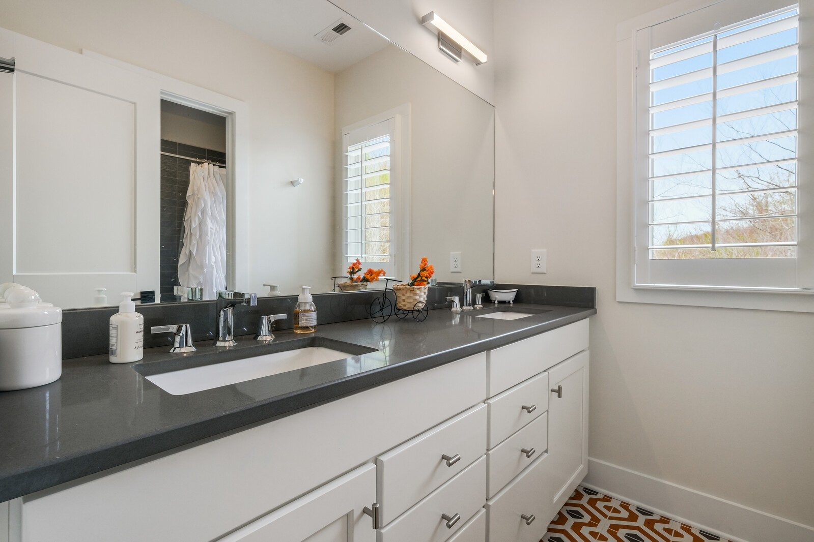 5304 Old Harding Road Franklin, TN 37064 - Photo 40 of 67 a bathroom with double sink and a mirror