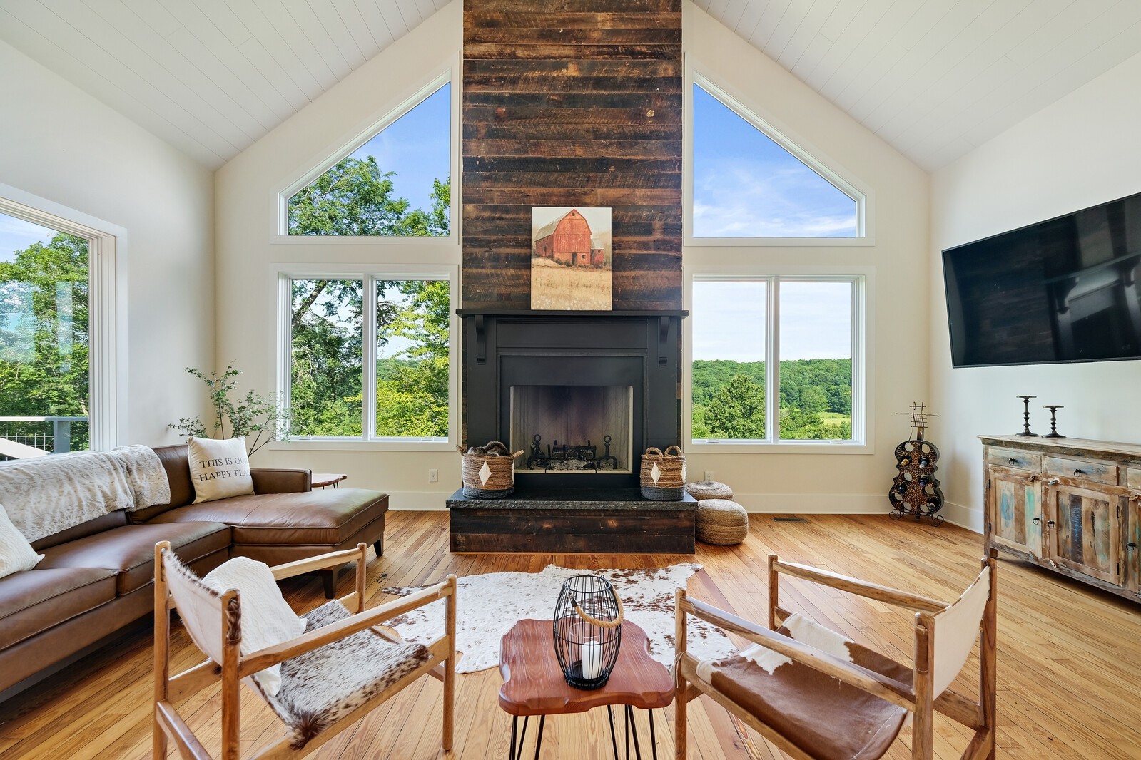 5304 Old Harding Road Franklin, TN 37064 - Photo 8 of 67 a living room with furniture a flat screen tv and a fireplace